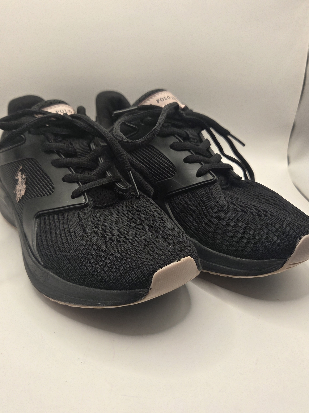 U.S. Polo Assn. athletic sneakers with a distinctive rose gold logo